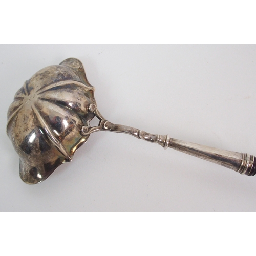 214 - An 18th Century silver bowled toddy ladle