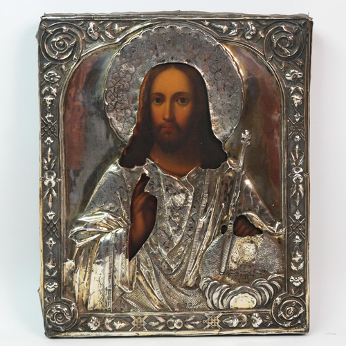 324 - A mid-19th Century Russian icon depicting Christ with Russian silver oklad