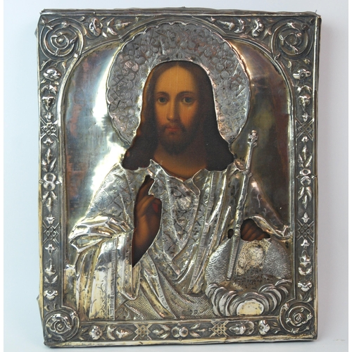 324 - A mid-19th Century Russian icon depicting Christ with Russian silver oklad