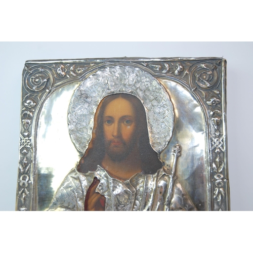 324 - A mid-19th Century Russian icon depicting Christ with Russian silver oklad