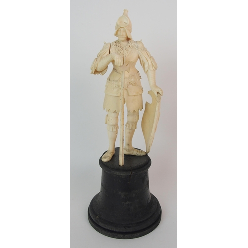 327 - An early Continental carved ivory figure of a knight