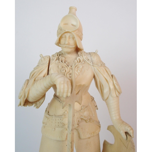 327 - An early Continental carved ivory figure of a knight