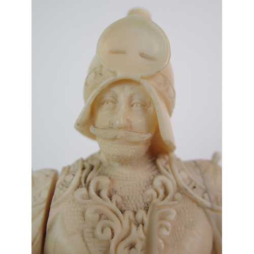 327 - An early Continental carved ivory figure of a knight