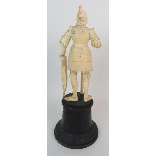 327 - An early Continental carved ivory figure of a knight