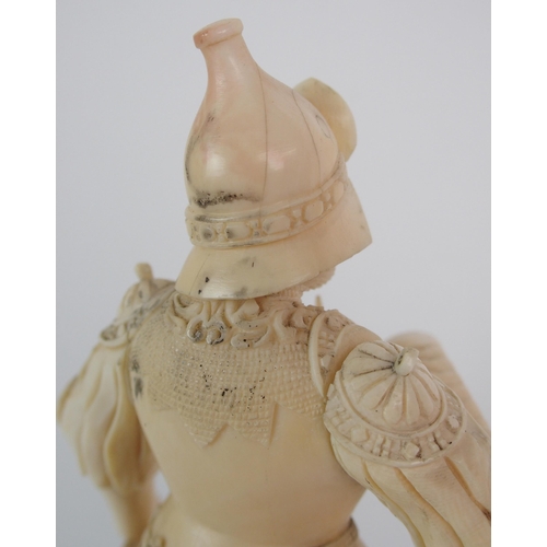 327 - An early Continental carved ivory figure of a knight