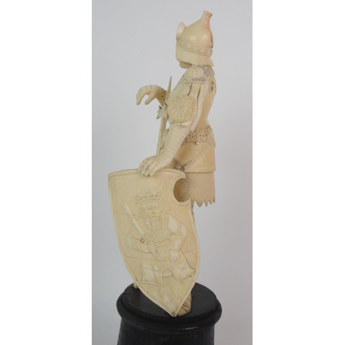 327 - An early Continental carved ivory figure of a knight