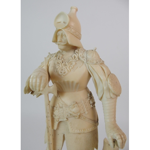 327 - An early Continental carved ivory figure of a knight