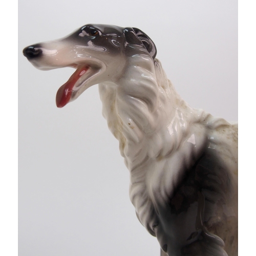 472 - A Goldscheider Pottery model of a woman and a Borzoi