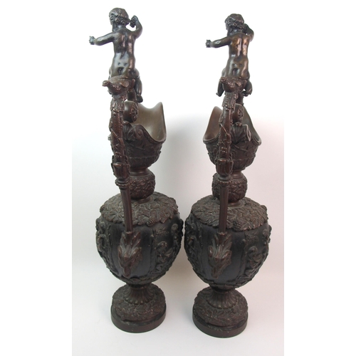 477 - A large pair of bronze ornamental jugs