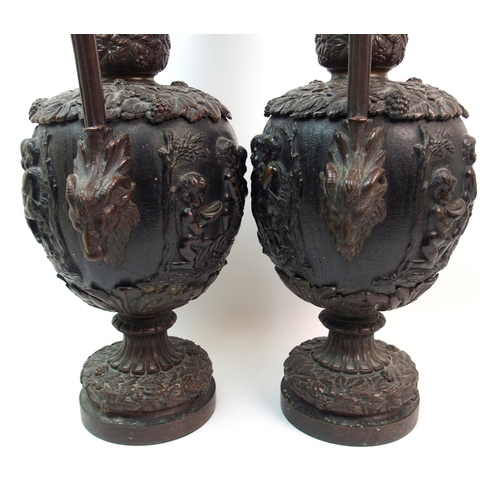 477 - A large pair of bronze ornamental jugs