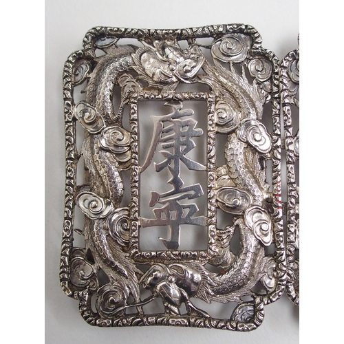 48 - A Chinese white metal belt buckle
