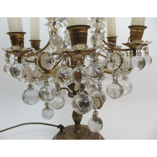 494 - A gilded metal and glass table lamp