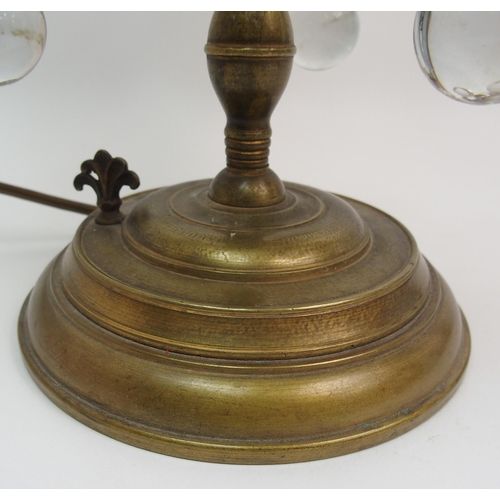 494 - A gilded metal and glass table lamp