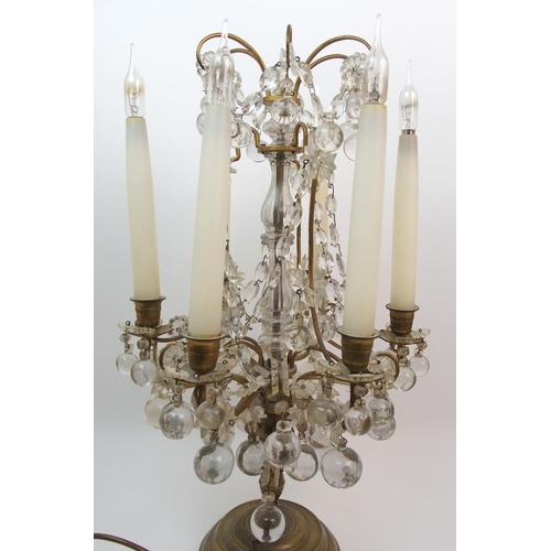 494 - A gilded metal and glass table lamp