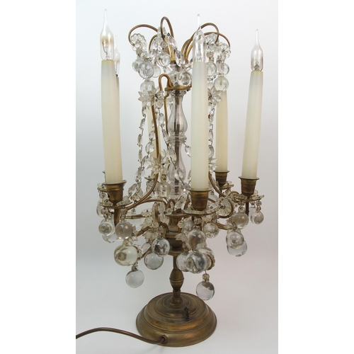 494 - A gilded metal and glass table lamp