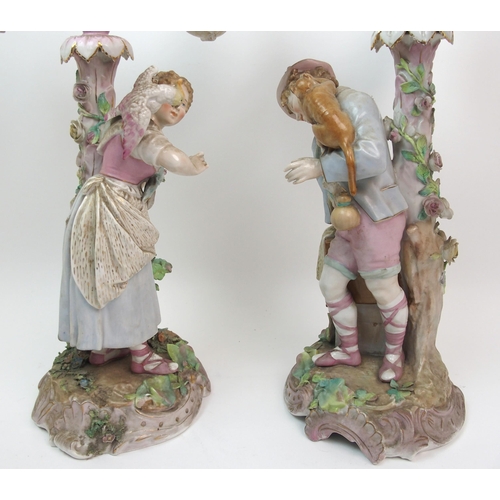 499 - A pair of 19th century continental porcelain figural candelabra