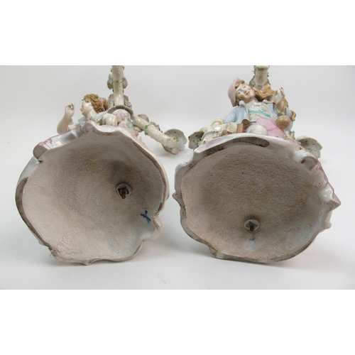 499 - A pair of 19th century continental porcelain figural candelabra