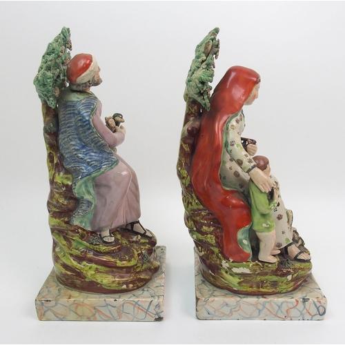 504 - A pair of 19th Century Staffordshire figures of Elijah and the Widow