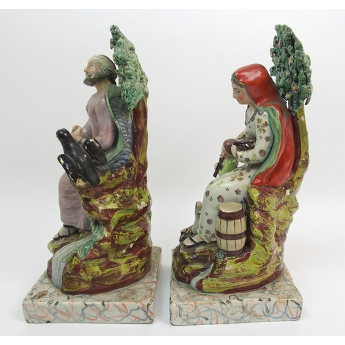 504 - A pair of 19th Century Staffordshire figures of Elijah and the Widow