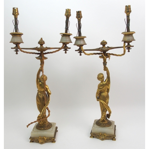 512 - A pair of French gilt bronze figural candelabras