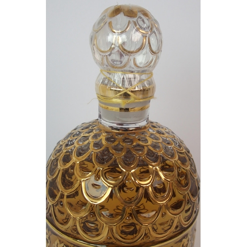 527 - A Guerlain honeycomb and bee design display perfume bottle