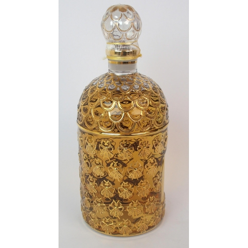 527 - A Guerlain honeycomb and bee design display perfume bottle