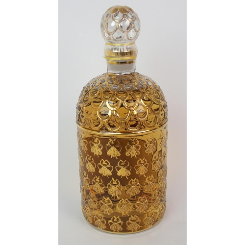 527 - A Guerlain honeycomb and bee design display perfume bottle