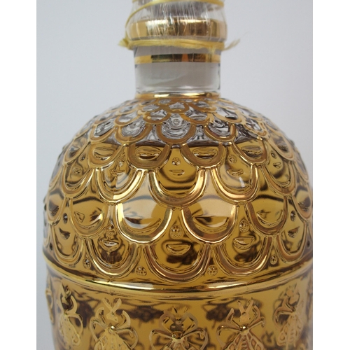 527 - A Guerlain honeycomb and bee design display perfume bottle