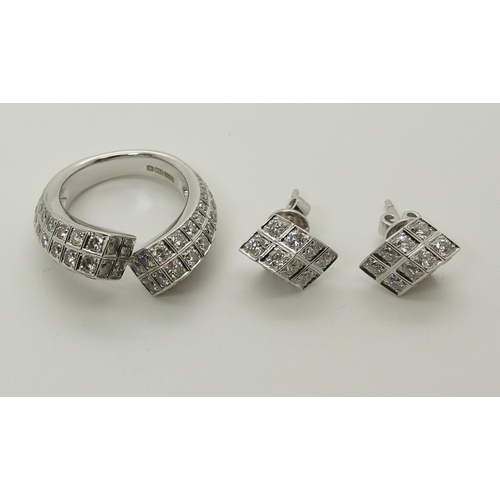 625 - An Eric Smith diamond ring with matching earrings