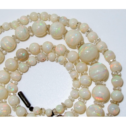 628 - A string of white opal beads