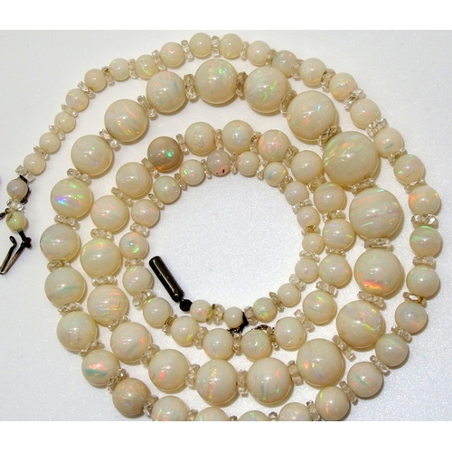 628 - A string of white opal beads