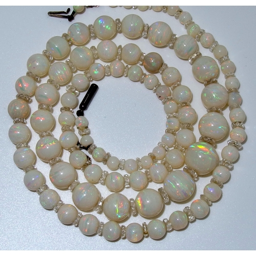 628 - A string of white opal beads