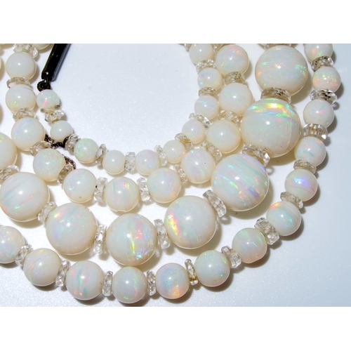 628 - A string of white opal beads