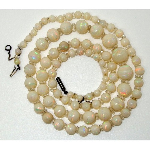 628 - A string of white opal beads