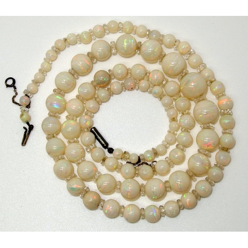 628 - A string of white opal beads