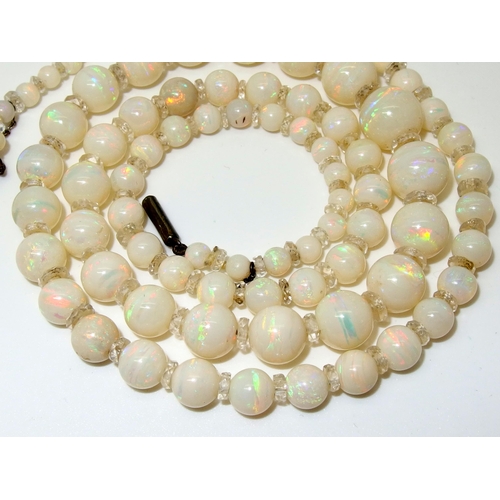 628 - A string of white opal beads