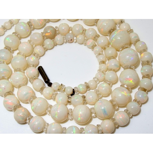 628 - A string of white opal beads