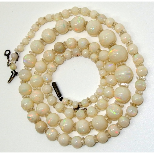 628 - A string of white opal beads