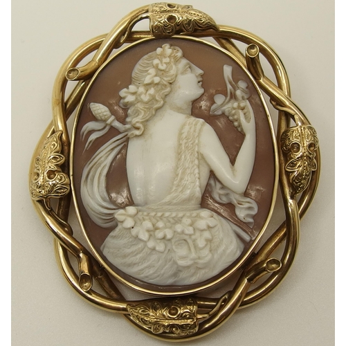 639 - A large shell cameo of a maiden in yellow metal brooch mount