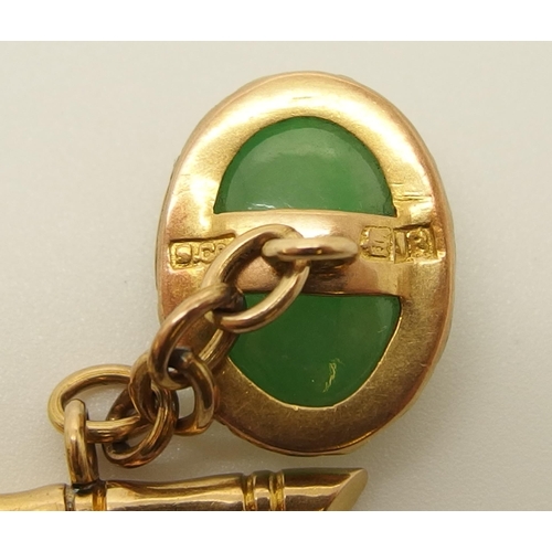 643 - A pair of 18ct Chinese gold  Chinese green hardstone cufflinks