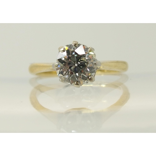 644 - An 18ct yellow and white gold diamond solitaire ring