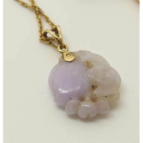 646 - A Chinese lilac coloured hardstone pendant and earrings