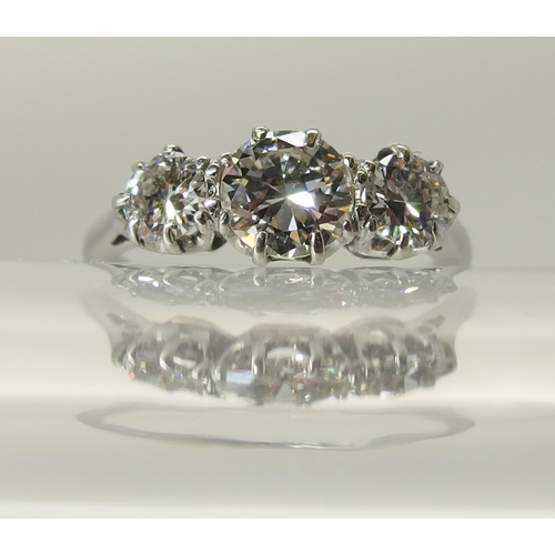 649 - A platinum three stone diamond ring