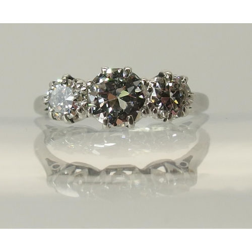 649 - A platinum three stone diamond ring