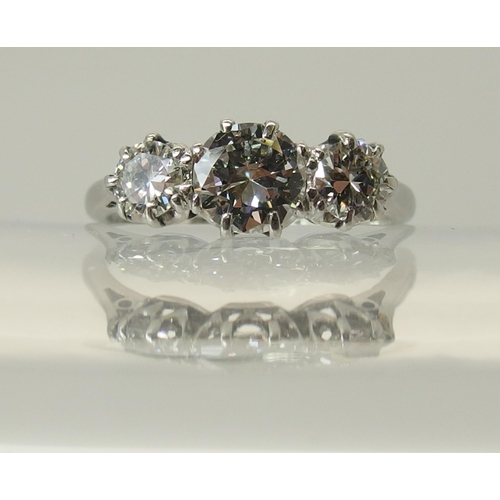 649 - A platinum three stone diamond ring