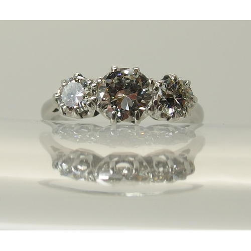 649 - A platinum three stone diamond ring