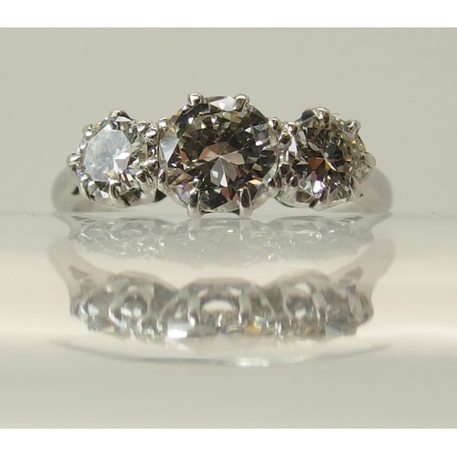 649 - A platinum three stone diamond ring