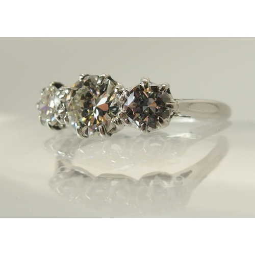 649 - A platinum three stone diamond ring