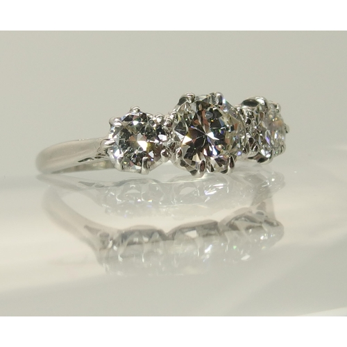 649 - A platinum three stone diamond ring