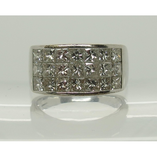 658 - An 18ct white gold and princess cut diamond ring made by Eric Smith